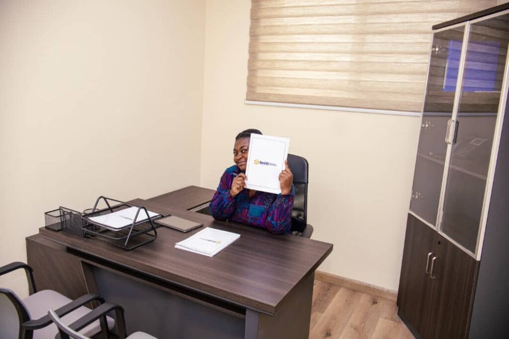 Professional client working in a bright, well-equipped Smith Desk office.