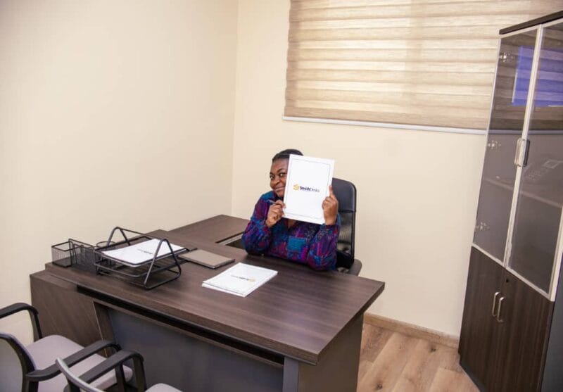 Professional client working in a bright, well-equipped Smith Desk office.